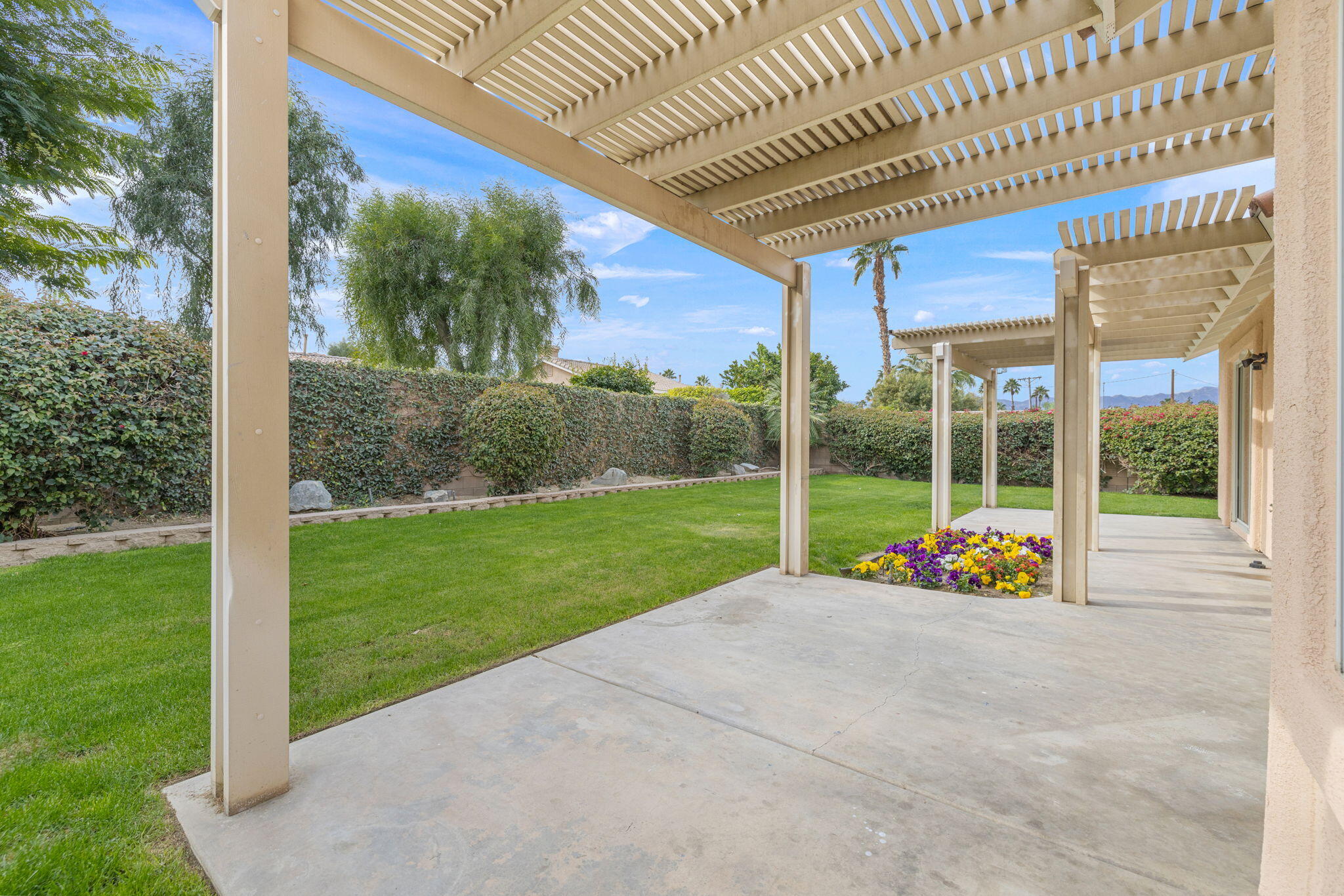 80601 Declaration Avenue Indio, CA 92201 - Photo 38 of 52 a view of an entryway with a garden