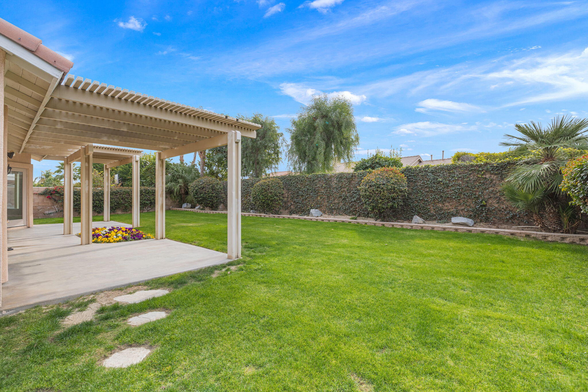 80601 Declaration Avenue Indio, CA 92201 - Photo 41 of 52 a view of a house with a backyard