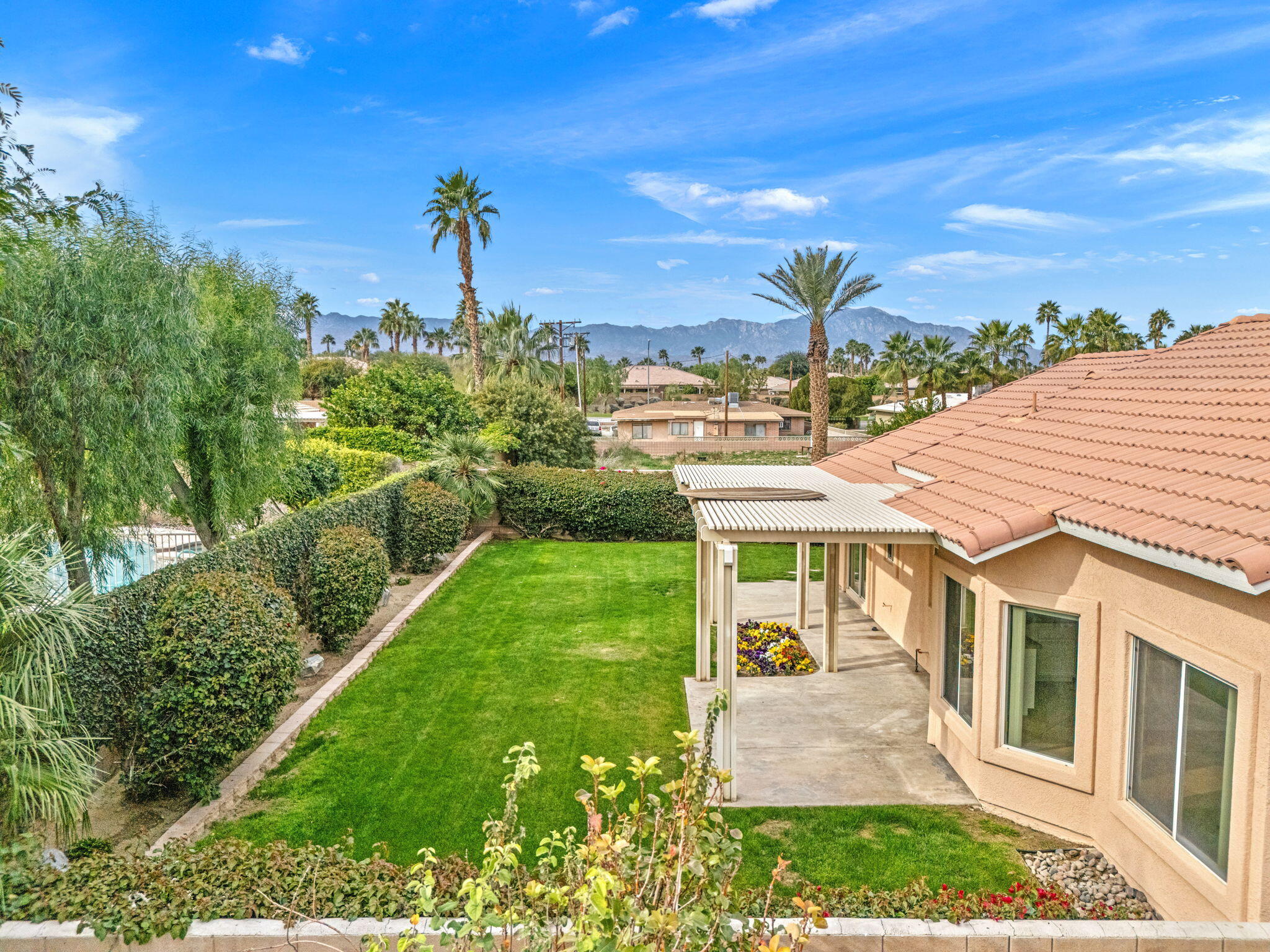 80601 Declaration Avenue Indio, CA 92201 - Photo 45 of 52 a front view of a house with a yard