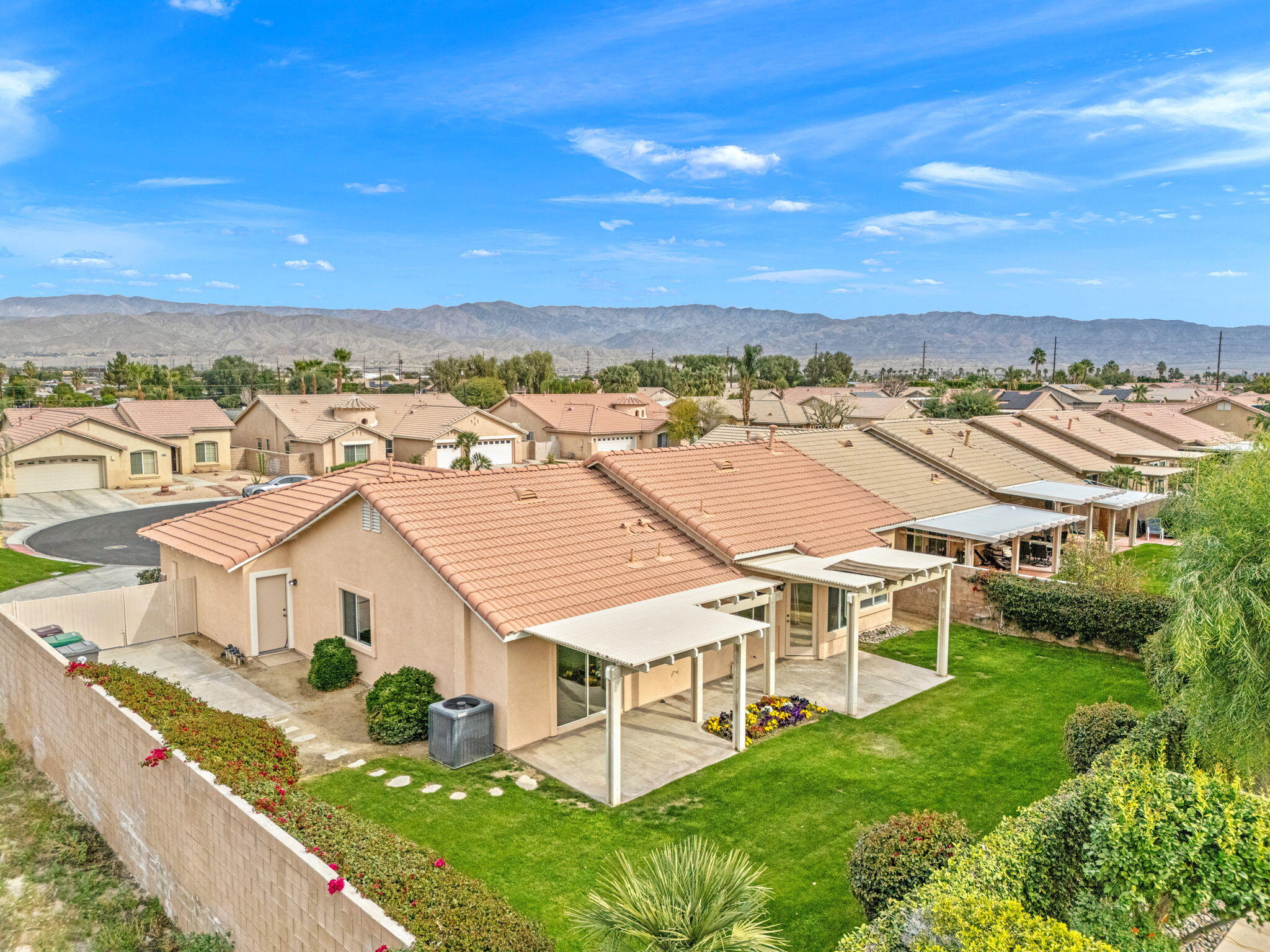 80601 Declaration Avenue Indio, CA 92201 - Photo 46 of 52 an aerial view of residential houses with outdoor space and trees