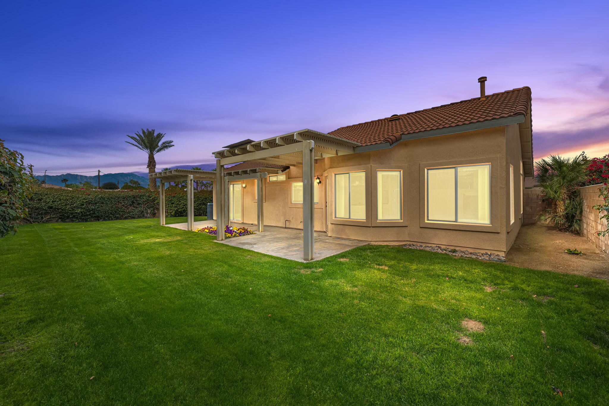 80601 Declaration Avenue Indio, CA 92201 - Photo 7 of 52 a front view of a house with a yard