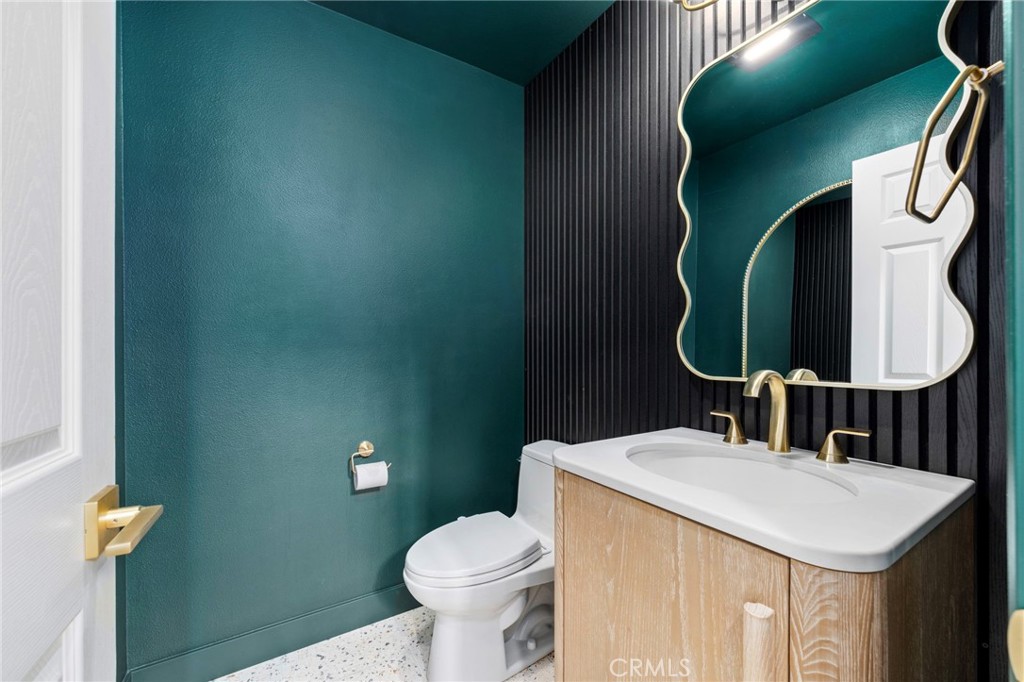 431 West Bay Street, Unit S Costa Mesa, CA 92627 - Photo 12 of 34 a bathroom with a toilet sink and mirror