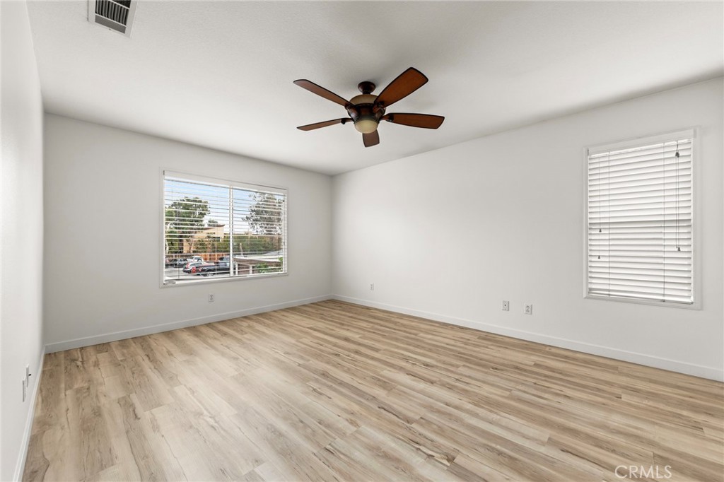 431 West Bay Street, Unit S Costa Mesa, CA 92627 - Photo 18 of 34 wooden floor in an empty room with a window