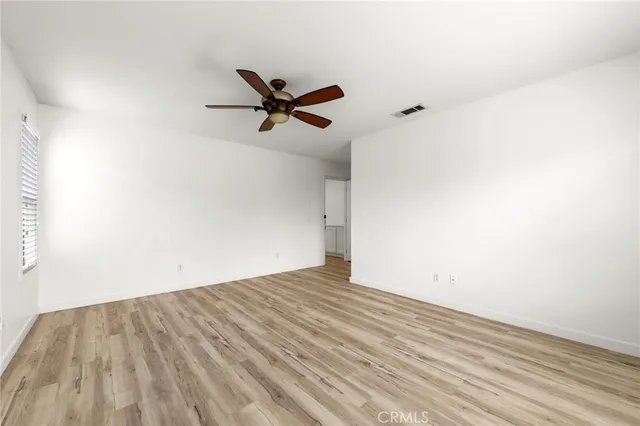 a spacious bathroom with a double vanity sink a mirror and a shower