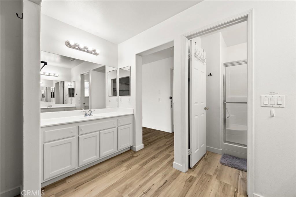 431 West Bay Street, Unit S Costa Mesa, CA 92627 - Photo 20 of 34 a spacious bathroom with a double vanity sink a mirror and a shower