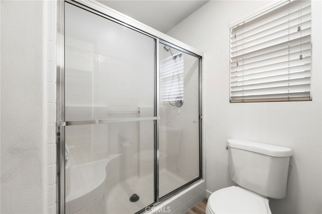 431 West Bay Street, Unit S Costa Mesa, CA 92627 - Photo 23 of 34 a bathroom with a shower and a toilet