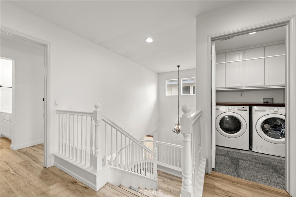 431 West Bay Street, Unit S Costa Mesa, CA 92627 - Photo 25 of 34 a view of a hallway with washer and dryer