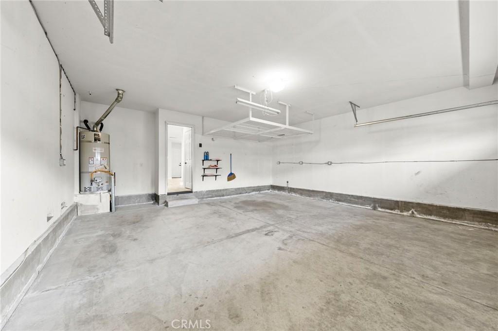 431 West Bay Street, Unit S Costa Mesa, CA 92627 - Photo 32 of 34 an empty room with a empty space and windows