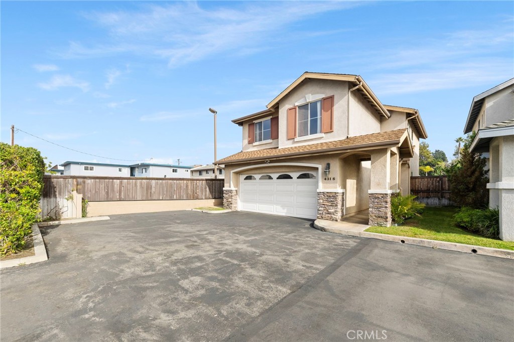 431 West Bay Street, Unit S Costa Mesa, CA 92627 - Photo 34 of 34 a view of a white house with a large space and large trees