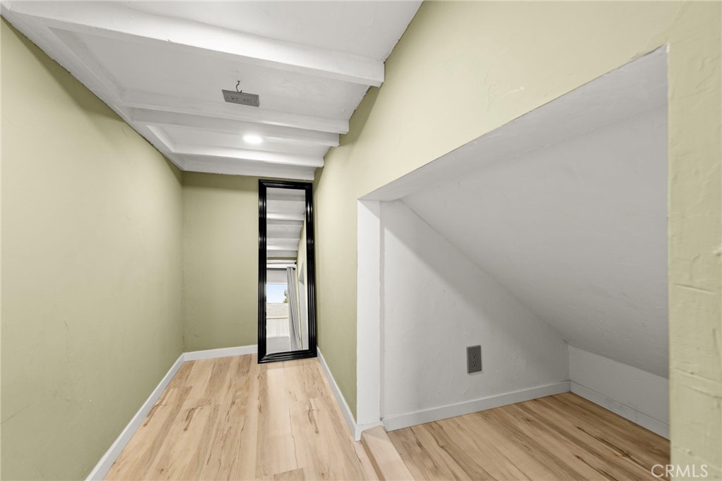 431 West Bay Street, Unit S Costa Mesa, CA 92627 - Photo 8 of 34 a view of a hallway with wooden floor and closet