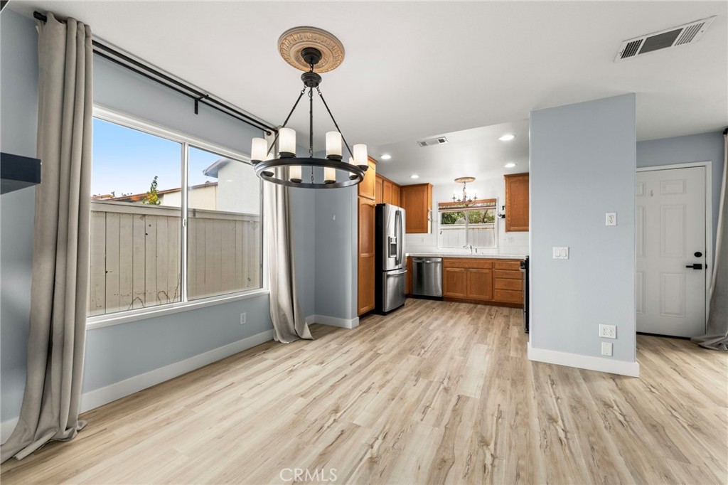 431 West Bay Street, Unit S Costa Mesa, CA 92627 - Photo 10 of 34 a view of a kitchen with a sink and wooden floor