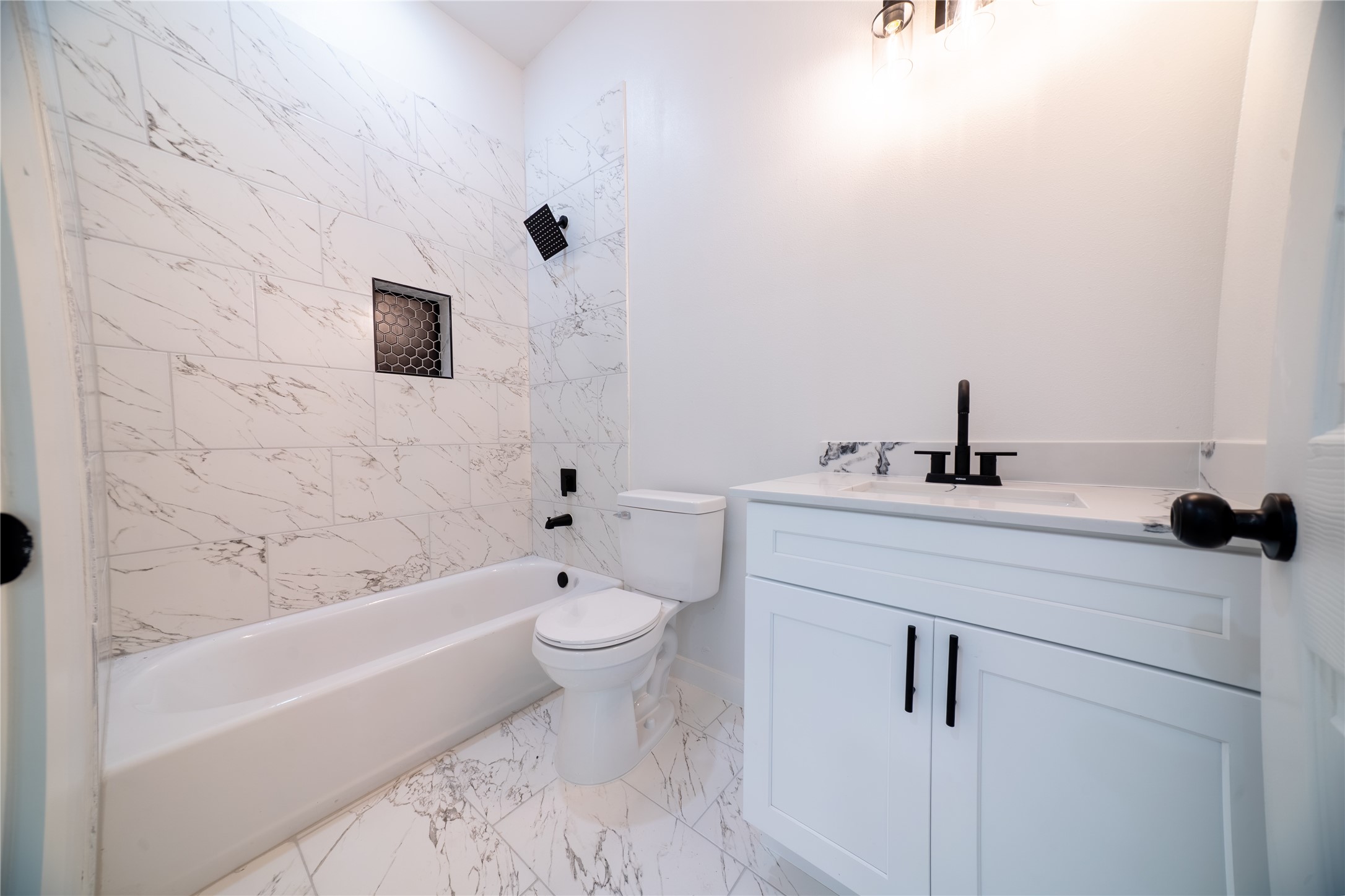 331 Delaware Street Houston, TX 77029 - Photo 12 of 12 a bathroom with a sink a toilet and shower