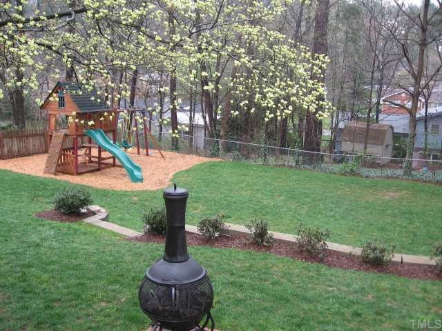 901 Tyrrell Road Raleigh, NC 27609 - Photo 12 of 12 .31 acre lot, totally fenced and beautifully landscaped, complete with an irrigation system.