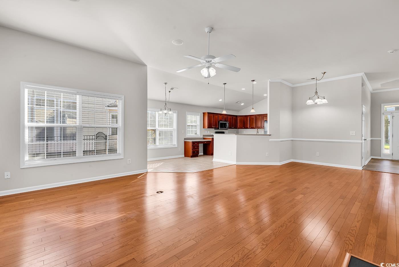 Unfurnished living room with a fireplace with flus