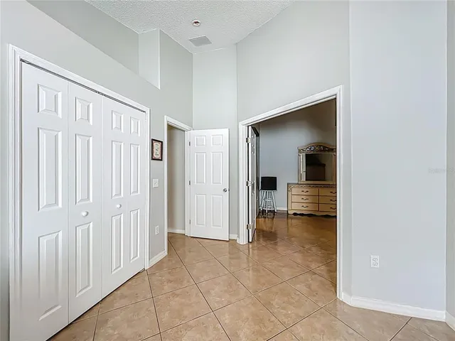 a view of a hallway with a room