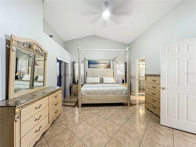 a bathroom with a double vanity sink a mirror and a bathtub