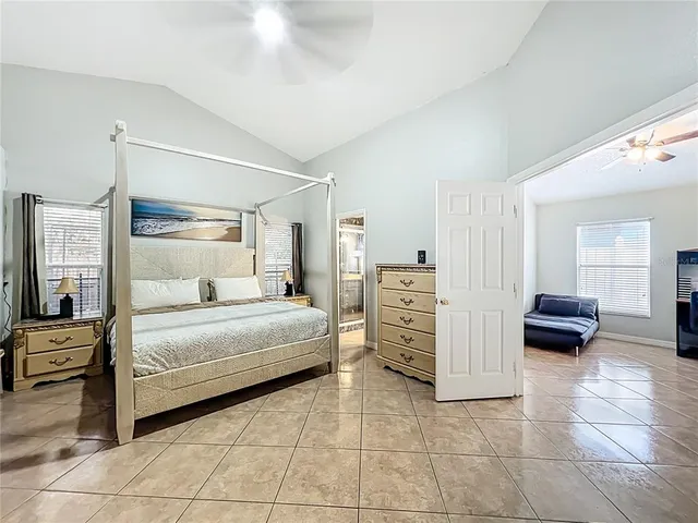 a bedroom with a bed and a view of bathroom
