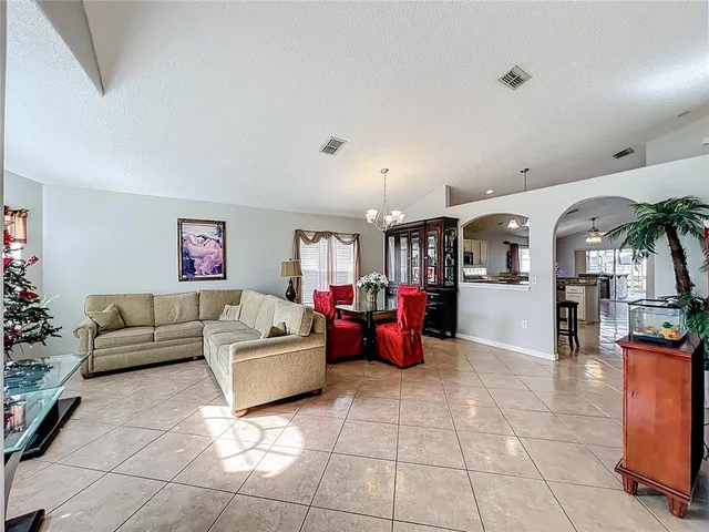 a living room with furniture and a table