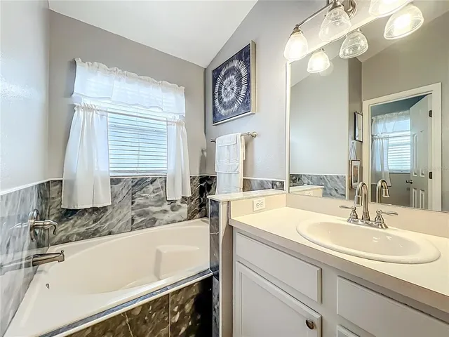 a bathroom with a sink and a bathtub