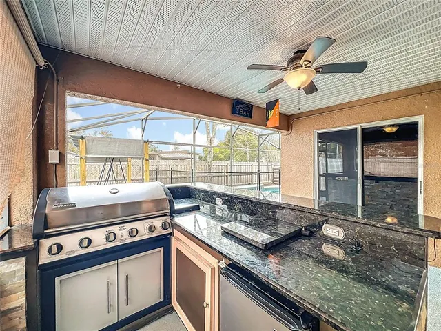 a kitchen with a stove and a sink