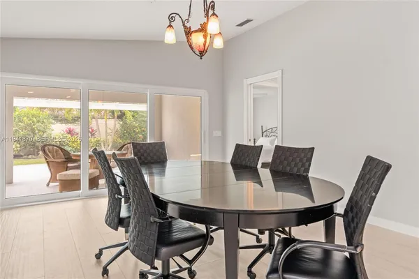 a view of a dining room with furniture window and outside view