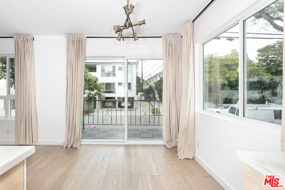 560 Kings Road, Unit 4 Los Angeles, CA 90048 - Photo 4 of 10 a view of an entryway with a floor to ceiling window