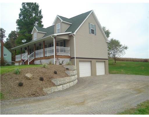 132 Hepler Road Sarver, PA 16055 - Photo 2 of 15 Exterior Front. 2 CAR AGRAGE. FULL FRONT PORCH. 4 BEDROOMS WITH A WALK IN CLOSET IN EACH BEDROOM. MASTER ON THE MAIN.