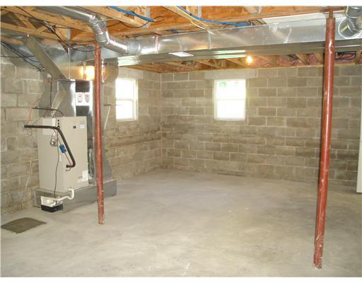 132 Hepler Road Sarver, PA 16055 - Photo 14 of 15 Other. LARGE UNFINISHED BASEMENT WITH WINDOWS, DOOR TO GARAGE AND A MAN DOOR FROM GARAGE TO BACK YARD.