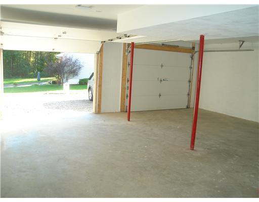 132 Hepler Road Sarver, PA 16055 - Photo 15 of 15 Parking Lot/Garage. LARGE 2 CAR GARAGE WITH A MAN DOOR TO BACK YARD AND DOOR TO BASEMENT.