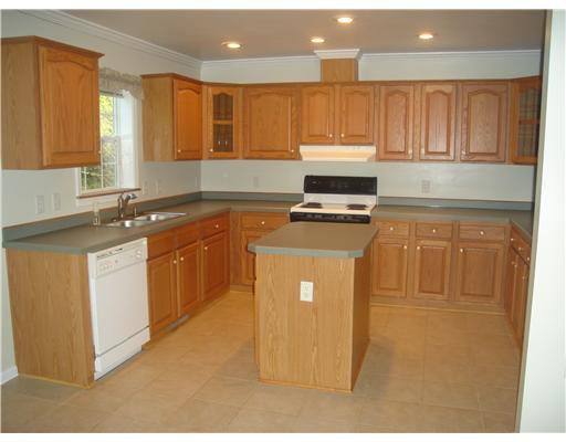 132 Hepler Road Sarver, PA 16055 - Photo 4 of 15 Kitchen. CERAMIC TILE, OPEN FLOOR PLAN. FRESH PAINT. OAK CABINETS.