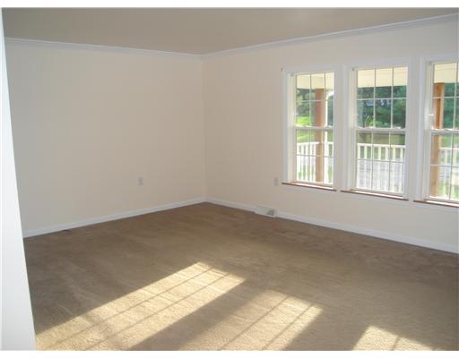 132 Hepler Road Sarver, PA 16055 - Photo 7 of 15 Living Room. HUGE LIVING ROOM WITH 3 LARGE WINDOWS, FRESH PAINT. OPEN FLOOR PLAN