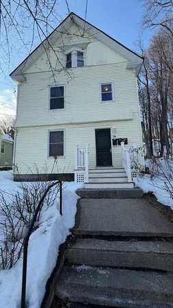 a view of a house with a roof deck