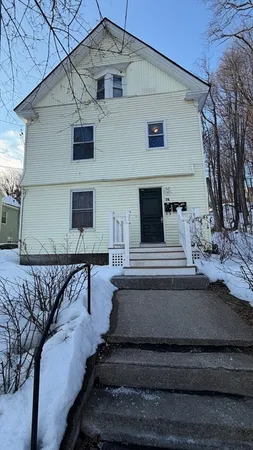 a view of a house with a roof deck