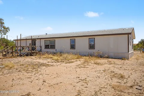 a view of a backyard of a house