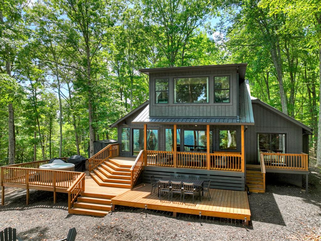 65 Highland Tower Road Blue Ridge, GA 30513 - Photo 1 of 48 a front view of a house with a garden