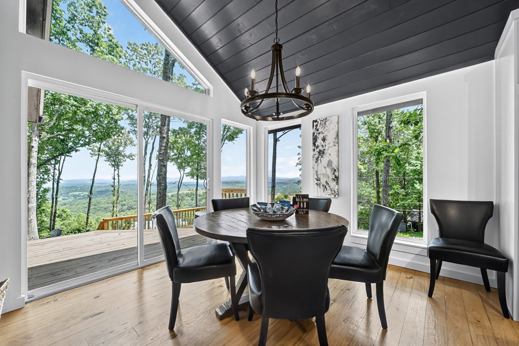 65 Highland Tower Road Blue Ridge, GA 30513 - Photo 13 of 48 a view of a dining room with furniture window and outside view
