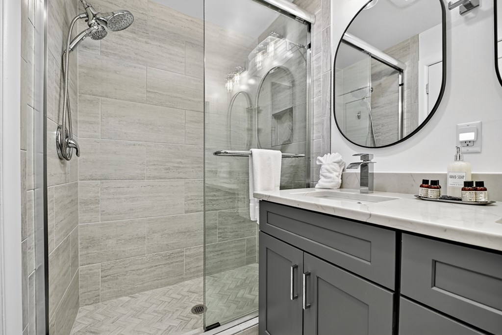 65 Highland Tower Road Blue Ridge, GA 30513 - Photo 27 of 48 a bathroom with a granite countertop sink a mirror and shower