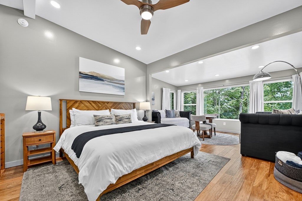 65 Highland Tower Road Blue Ridge, GA 30513 - Photo 29 of 48 a bedroom with a bed a couch and a large window