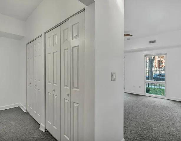 a view of a hallway with natural light