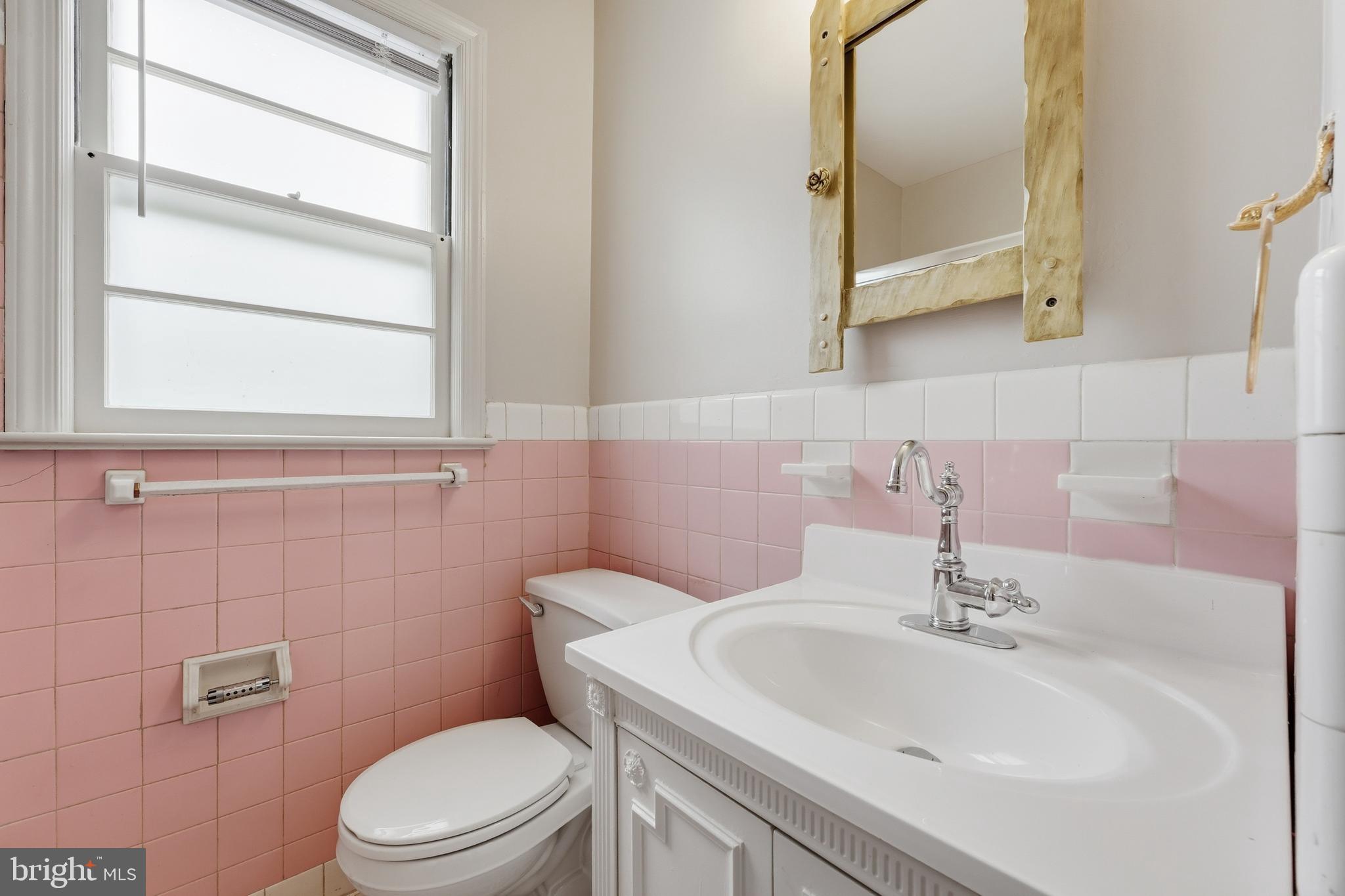 228 Northwest Terrace Silver Spring, MD 20901 - Photo 36 of 70 a bathroom with a sink a toilet and a mirror