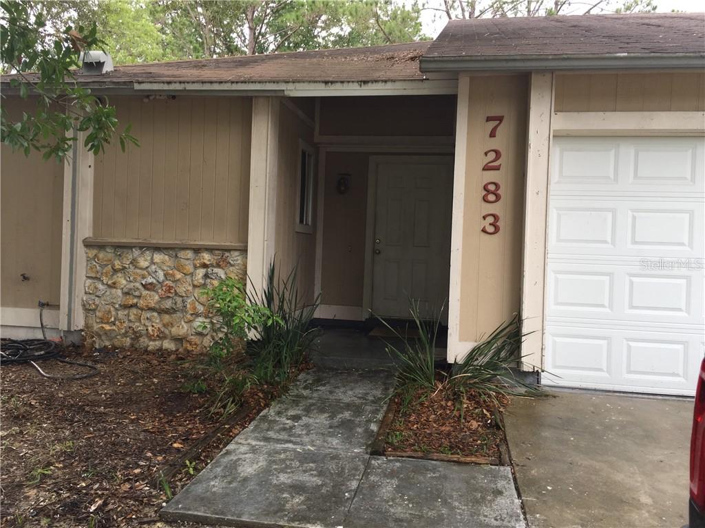 7283 Oak Meadows Circle, Unit 1 Orlando, FL 32835 - Photo 1 of 1 a backyard of a house