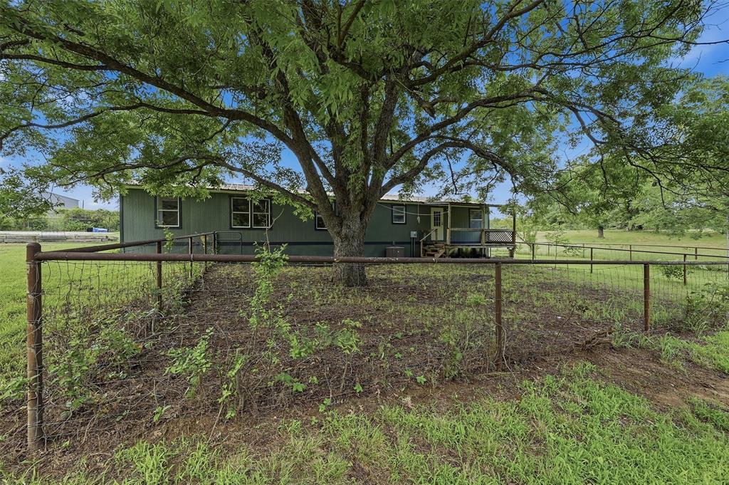 150 Gilbreath Road Sadler, TX 76264 - Photo 30 of 34 a front view of a house with a yard