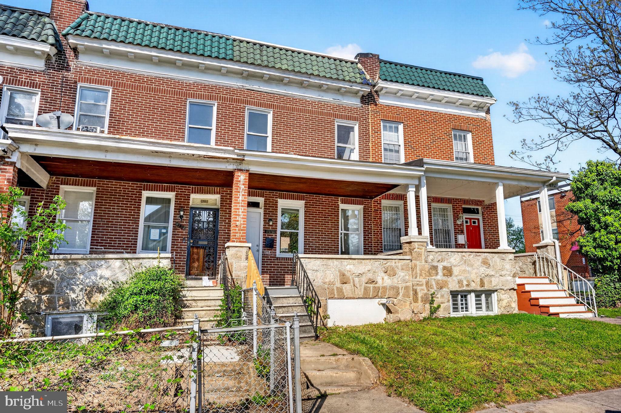 1358 Homestead Street Baltimore, MD 21218 - Photo 1 of 35 front view of a brick house with a yard