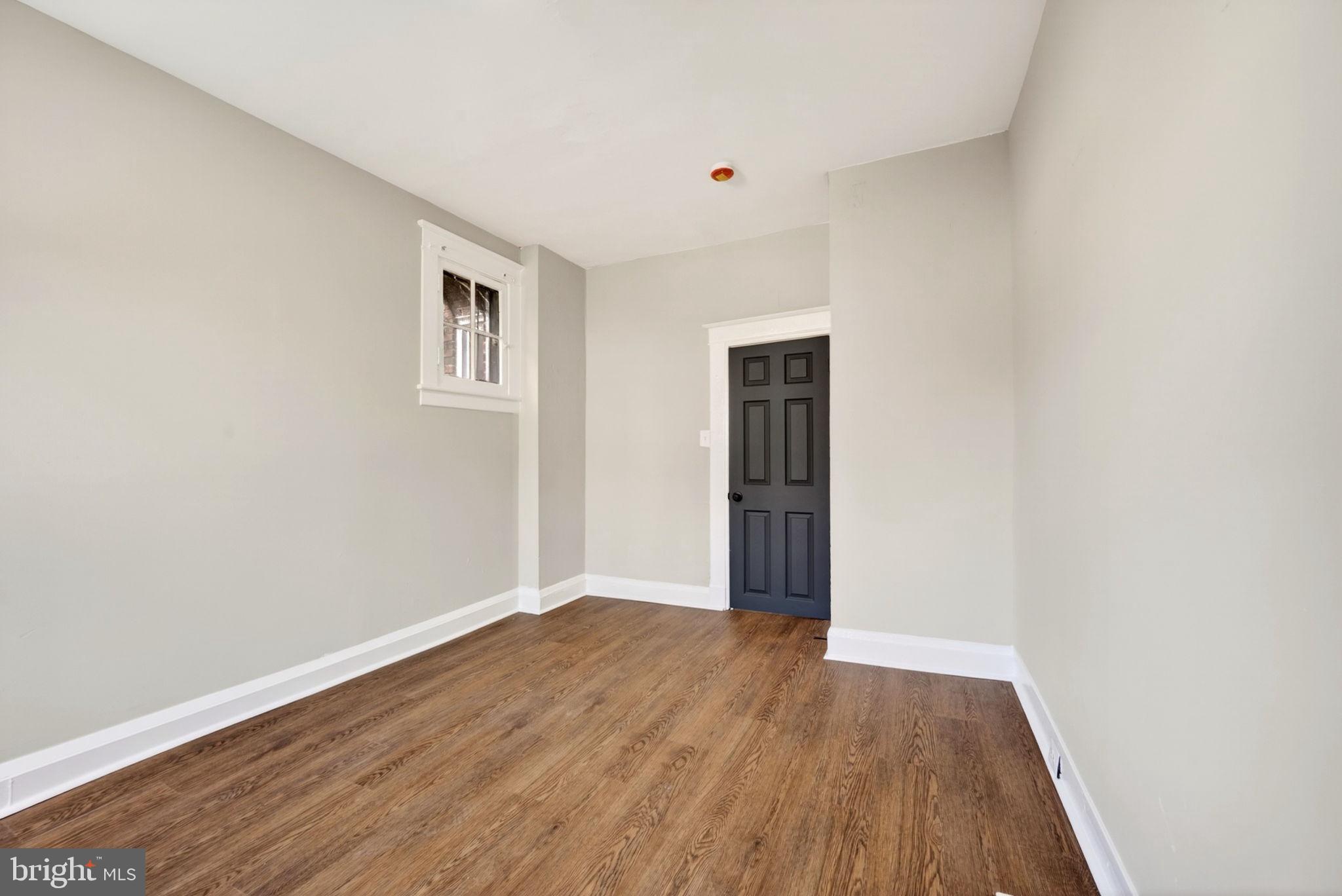 1358 Homestead Street Baltimore, MD 21218 - Photo 14 of 35 a view of an empty room with wooden floor