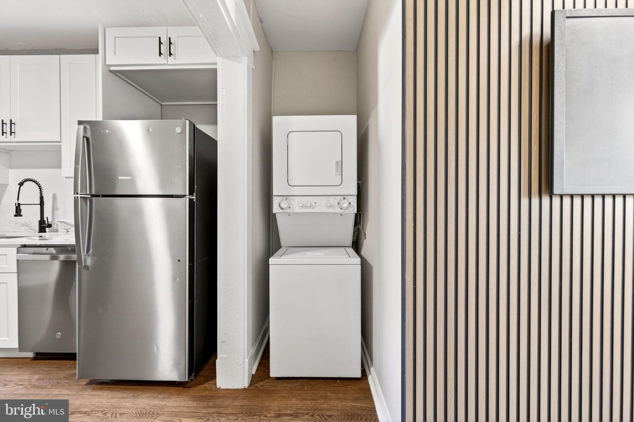 1358 Homestead Street Baltimore, MD 21218 - Photo 17 of 35 a white refrigerator freezer and a dishwasher sitting in a kitchen