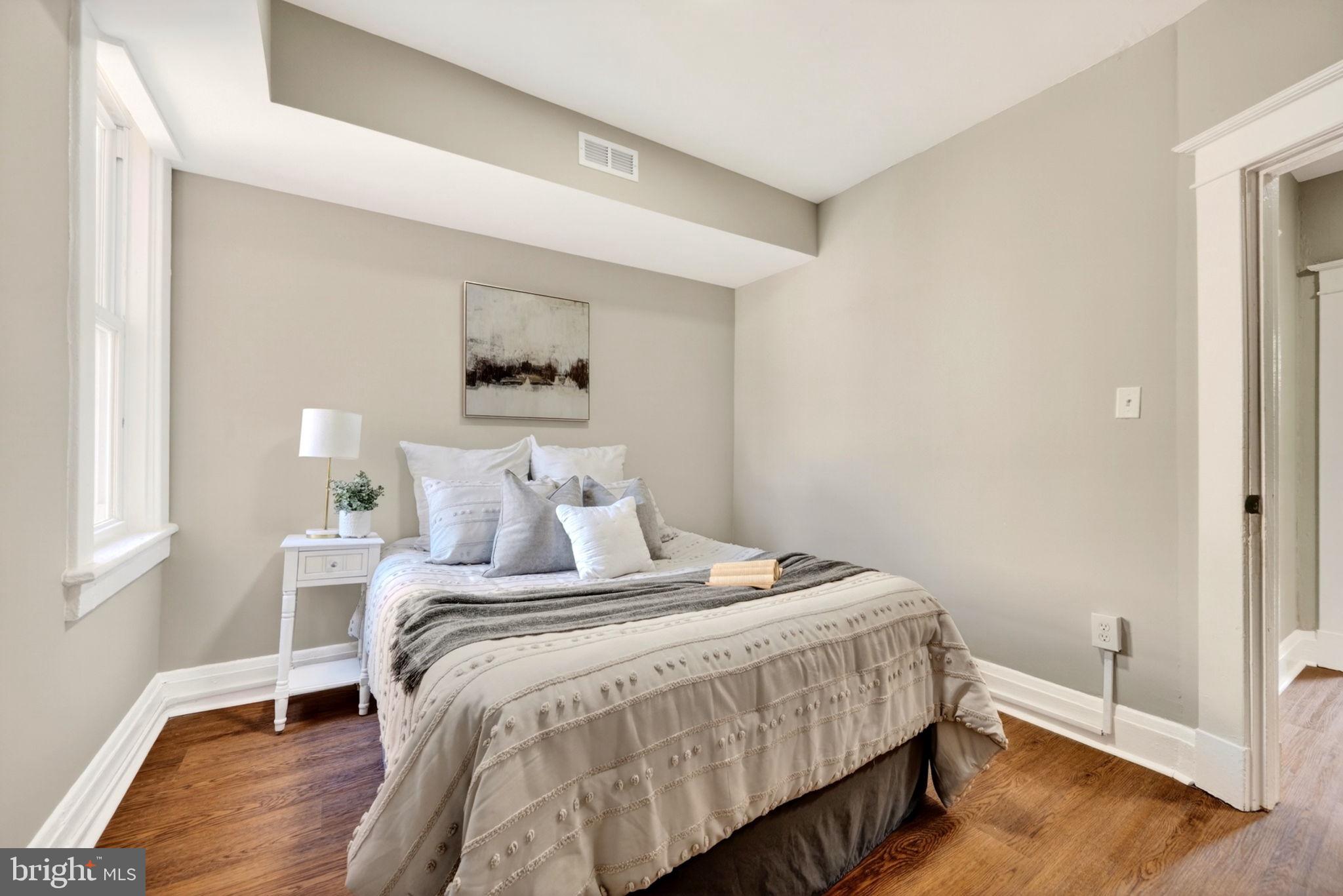 1358 Homestead Street Baltimore, MD 21218 - Photo 23 of 35 a bedroom with a bed and a window