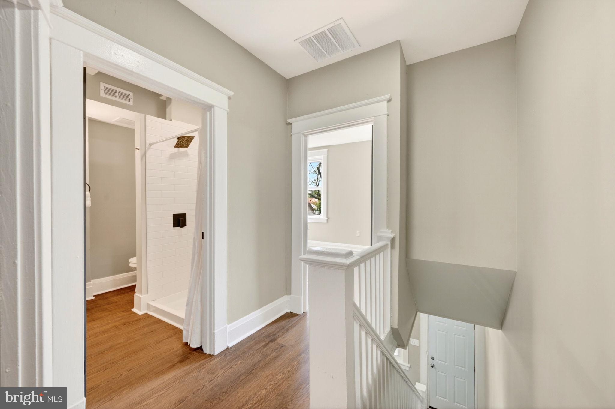 1358 Homestead Street Baltimore, MD 21218 - Photo 28 of 35 a view of a hallway with wooden floor and entryway