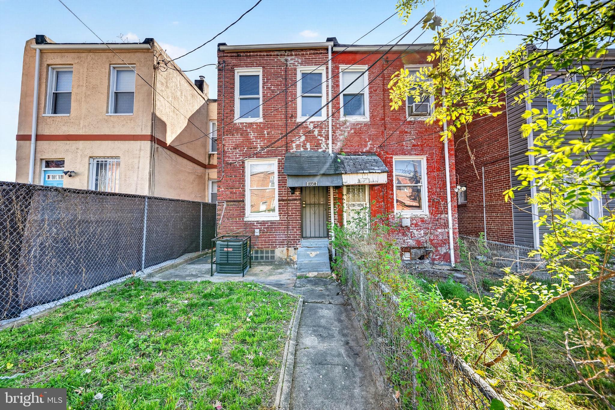1358 Homestead Street Baltimore, MD 21218 - Photo 33 of 35 a backyard of a house with a garden and outdoor seating