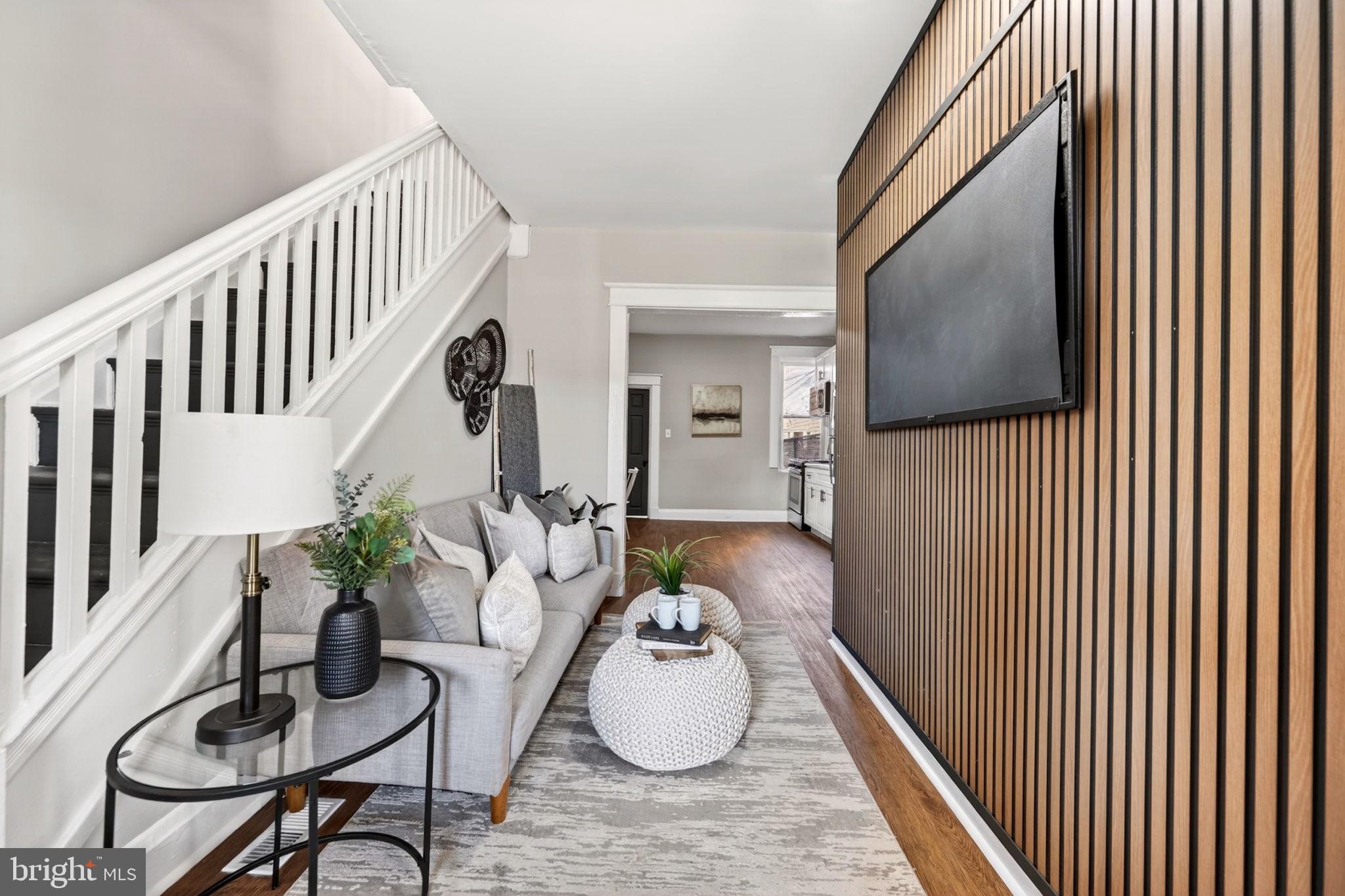 1358 Homestead Street Baltimore, MD 21218 - Photo 5 of 35 a hallway with furniture and a potted plant