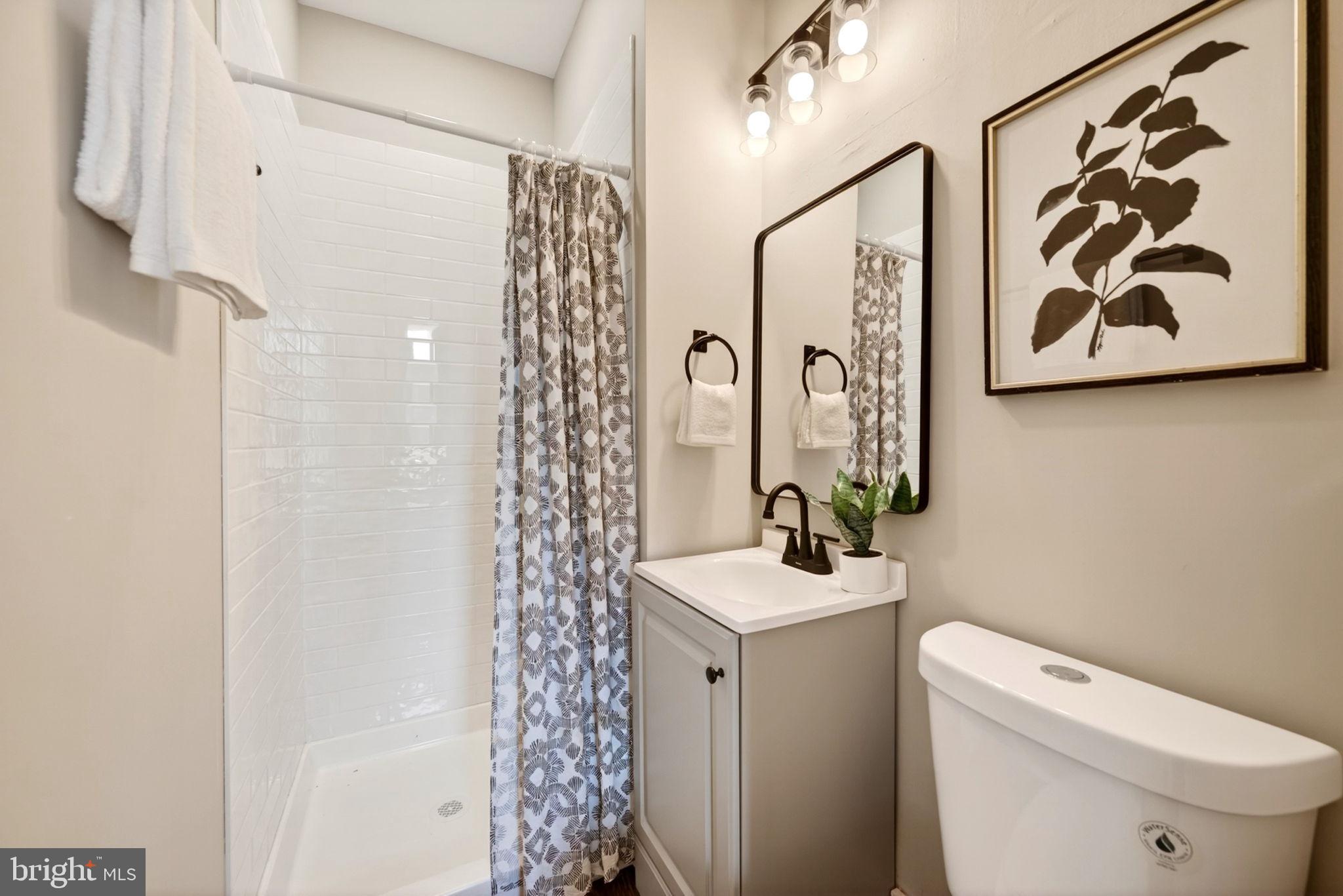 1358 Homestead Street Baltimore, MD 21218 - Photo 8 of 35 a bathroom with a sink and a toilet